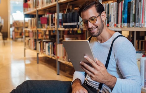 man-with-tablet-library